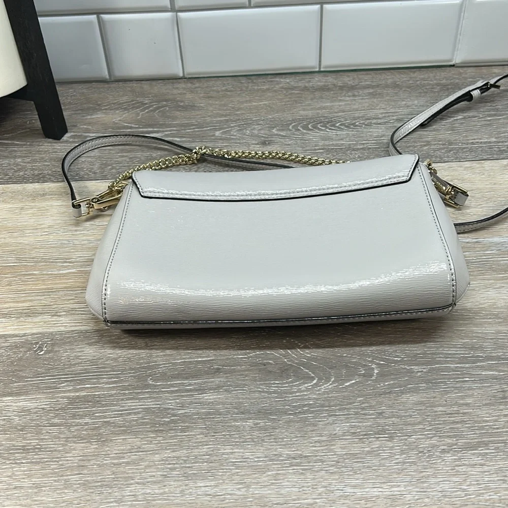 Kate Spade gray crossbody with gold chain